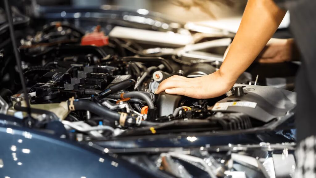 a mechanic working on an engine